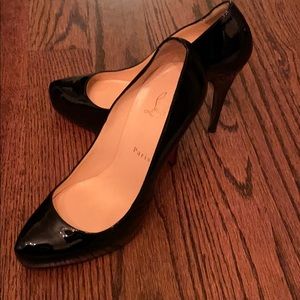 Black Louboutin pumps